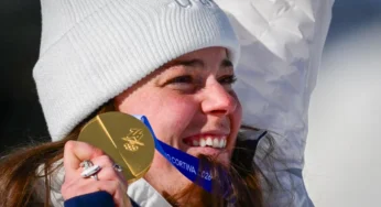 American skier Breezy Johnson cares for her broken gold medal from 2026 Winter Games
