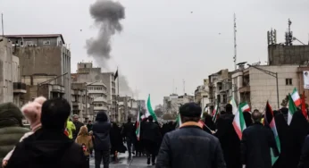 Iran blasts hit pro-government rally; Israel strikes continue